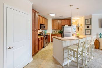 A kitchen with a white island